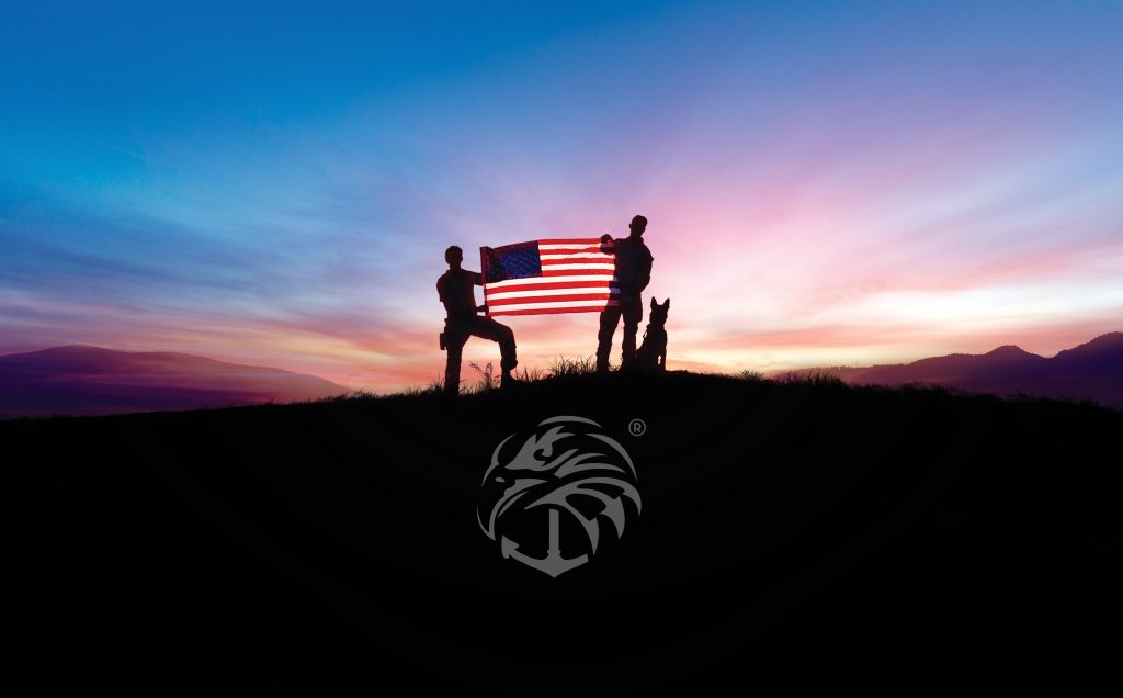 Silhouettes holding a U.S. flag with a dog at sunset, suitable as a navy seal wallpaper.