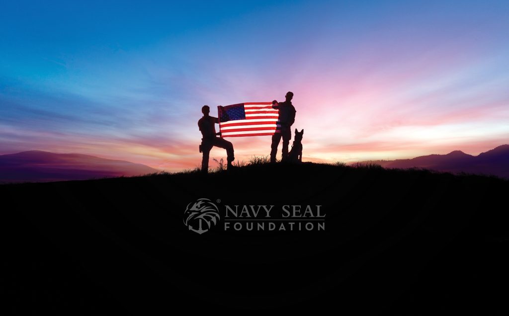 Silhouettes holding a U.S. flag with a dog against a sunset, featuring "Navy Seal Foundation" text.
