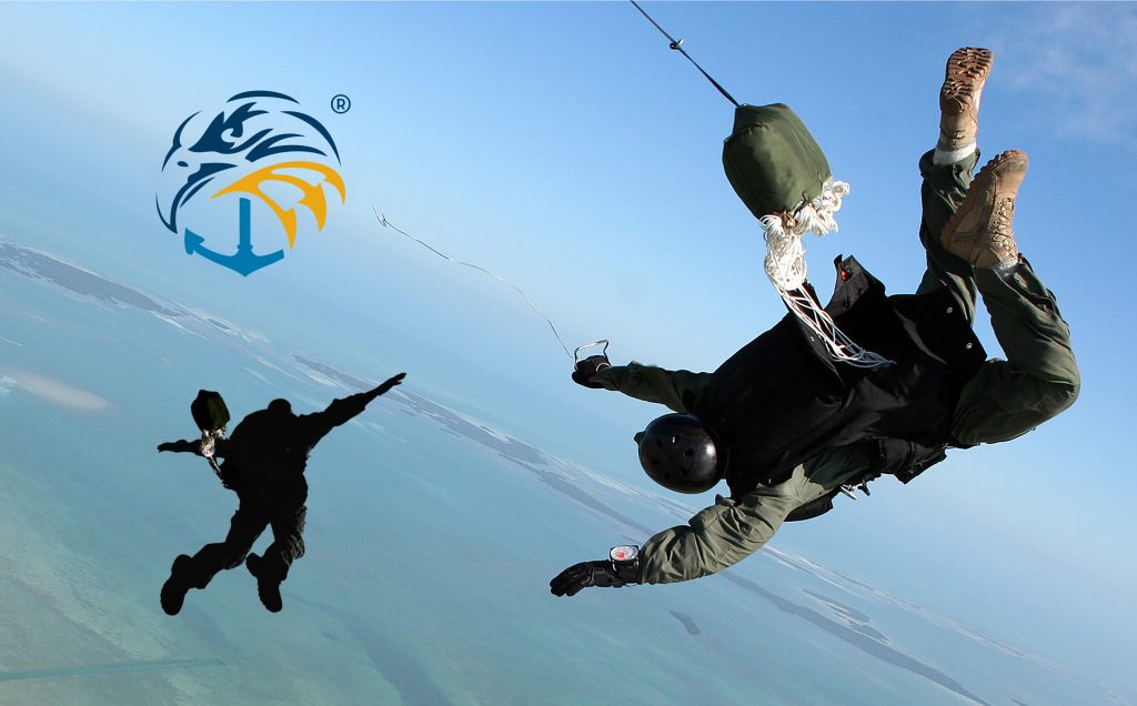 Skydiver in a military suit with a parachute against a background of blue sky and ocean, with a logo. Navy seal wallpaper.